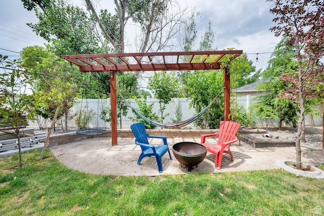2553 W Evening Dove Cir S, West Valley City, UT 84119 - fenced backyard featuring an outdoor fire pit and a patio area