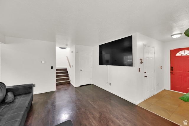 2553 W Evening Dove Cir S, West Valley City, UT 84119 - unfurnished living room with stairs and wood finished floors