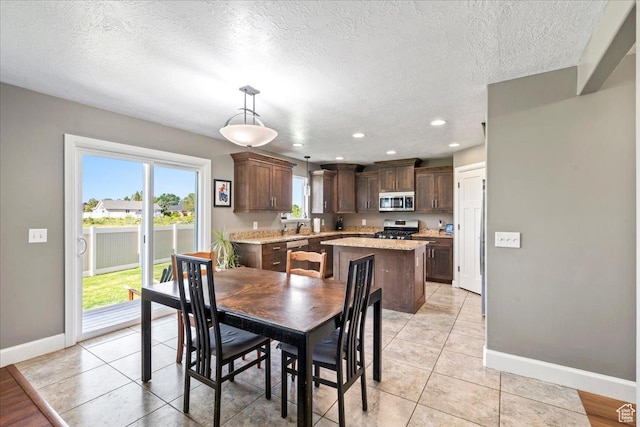 2007 N 850 E, North Ogden, UT 84414 - dining space with baseboards, a textured ceiling, recessed lighting, and light tile patterned floors