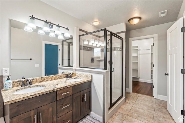 2007 N 850 E, North Ogden, UT 84414 - full bath featuring a stall shower, a spacious closet, double vanity, and baseboards