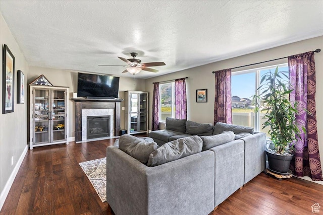 2007 N 850 E, North Ogden, UT 84414 - living room with hardwood / wood-style floors, healthy amount of natural light, a fireplace, ceiling fan, and a textured ceiling