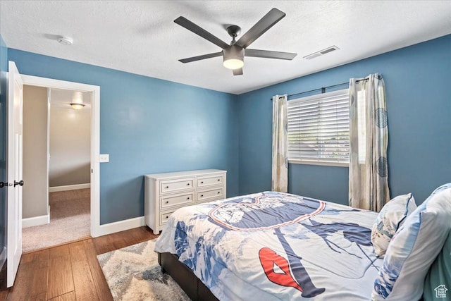 2007 N 850 E, North Ogden, UT 84414 - bedroom featuring wood finished floors, a textured ceiling, baseboards, and ceiling fan