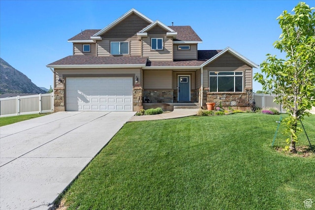 2007 N 850 E, North Ogden, UT 84414 - craftsman house featuring driveway, an attached garage, stone siding, and a mountain view