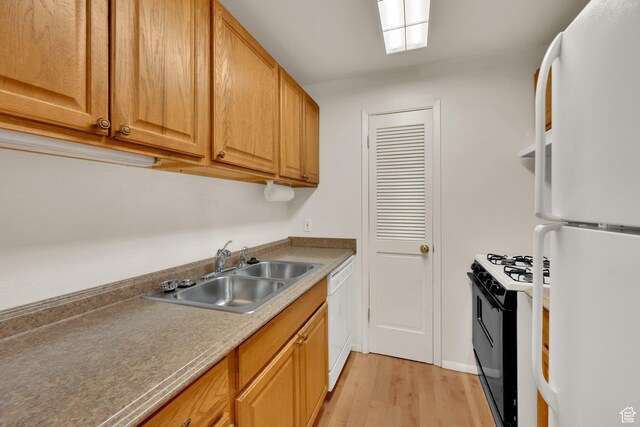 5323 S 560 E Unit D, Murray, UT 84107 - kitchen featuring white appliances, a sink, light wood-style floors, and brown cabinetry