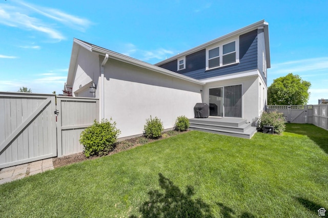 6178 W Sugarcane Dr, South Jordan, UT 84009 - back of house with a gate and stucco siding