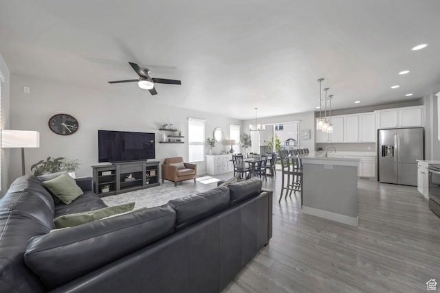 6178 W Sugarcane Dr, South Jordan, UT 84009 - living room featuring a ceiling fan, recessed lighting, and light wood-style floors
