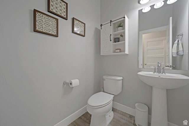 6178 W Sugarcane Dr, South Jordan, UT 84009 - half bath with toilet, baseboards, wood finished floors, and a sink