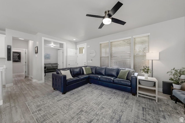 6178 W Sugarcane Dr, South Jordan, UT 84009 - living area with a ceiling fan, light wood-style flooring, and baseboards