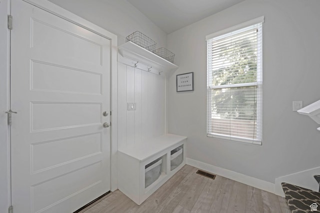 6178 W Sugarcane Dr, South Jordan, UT 84009 - mudroom featuring baseboards and light wood-style flooring