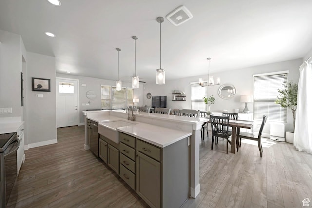 6178 W Sugarcane Dr, South Jordan, UT 84009 - kitchen featuring a sink, light countertops, light wood finished floors, stainless steel dishwasher, and recessed lighting