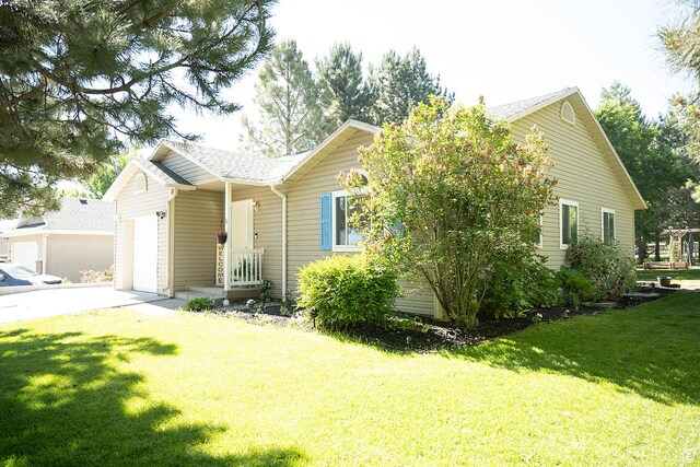 170 W 500 N, Wellsville, UT 84339 - ranch-style home featuring a garage, driveway, a front lawn, and roof with shingles