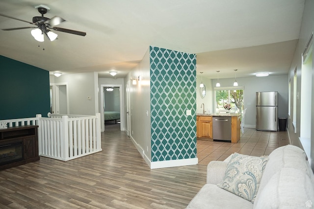 170 W 500 N, Wellsville, UT 84339 - living room featuring a ceiling fan and light wood-style flooring