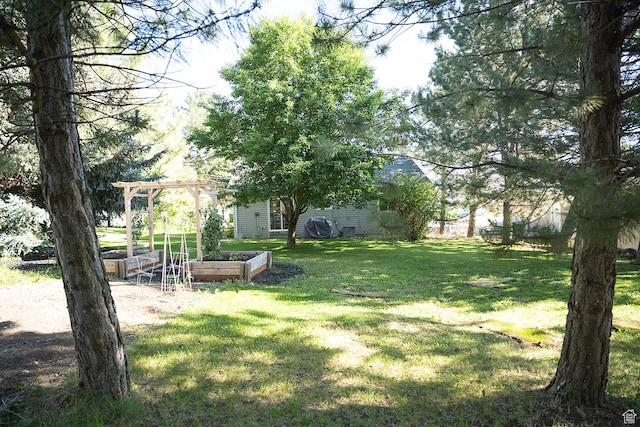 170 W 500 N, Wellsville, UT 84339 - view of yard featuring a vegetable garden and a pergola
