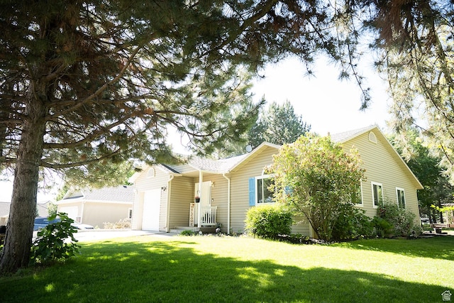 170 W 500 N, Wellsville, UT 84339 - view of front of home with a garage, a front yard, and driveway