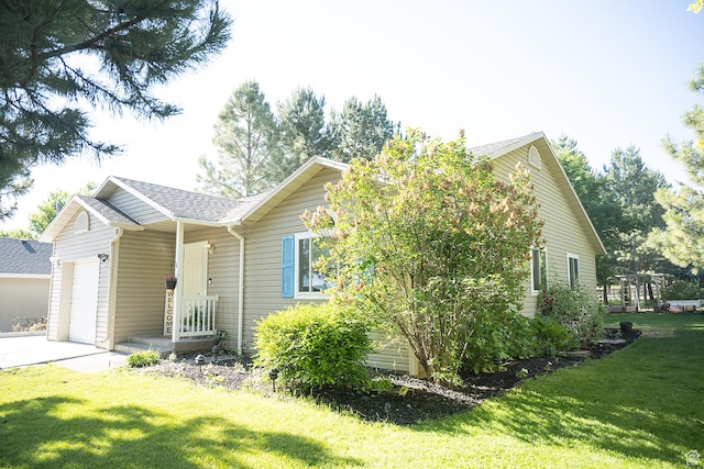 170 W 500 N, Wellsville, UT 84339 - ranch-style home with an attached garage, a front lawn, concrete driveway, and roof with shingles