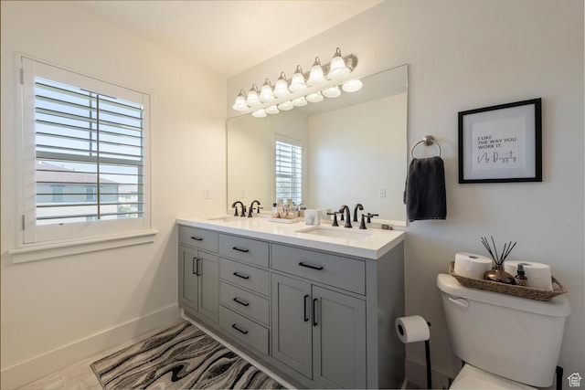 688 N 255 W, Centerville, UT 84014 - full bath featuring double vanity, toilet, and baseboards