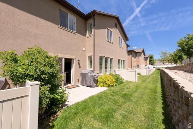 688 N 255 W, Centerville, UT 84014 - rear view of house with stucco siding, a patio area, and a residential view