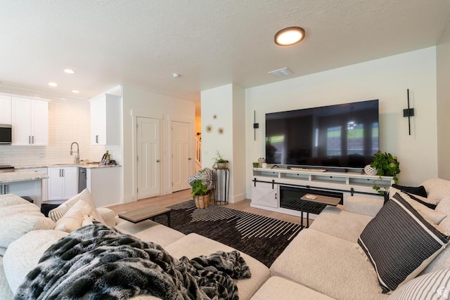 688 N 255 W, Centerville, UT 84014 - living area with light wood-style flooring and recessed lighting