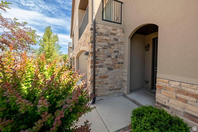 688 N 255 W, Centerville, UT 84014 - entrance to property featuring stucco siding, stone siding, and an attached garage