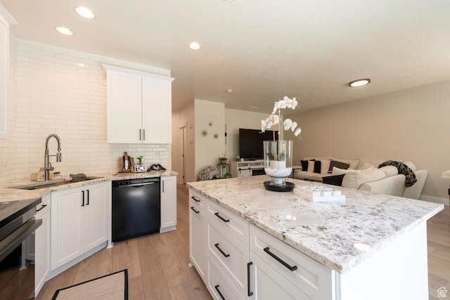 688 N 255 W, Centerville, UT 84014 - kitchen featuring dishwasher, a sink, open floor plan, light wood-type flooring, and recessed lighting