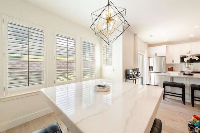 688 N 255 W, Centerville, UT 84014 - dining room featuring a chandelier, light wood-style floors, recessed lighting, and baseboards