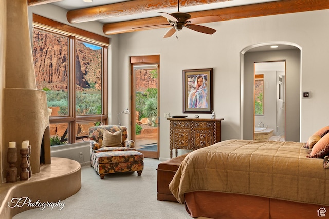 1936 N Uwan Dr, Ivins, UT 84738 - carpeted bedroom with access to outside, arched walkways, beamed ceiling, and ensuite bathroom