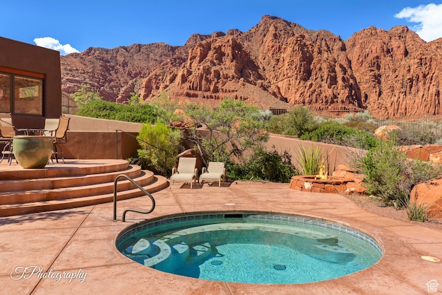 1936 N Uwan Dr, Ivins, UT 84738 - view of swimming pool with an in-ground hot tub, a patio area, a mountain view, and a pool