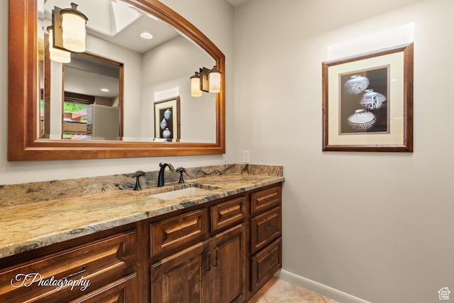 1936 N Uwan Dr, Ivins, UT 84738 - bathroom with vanity, baseboards, and tile patterned flooring