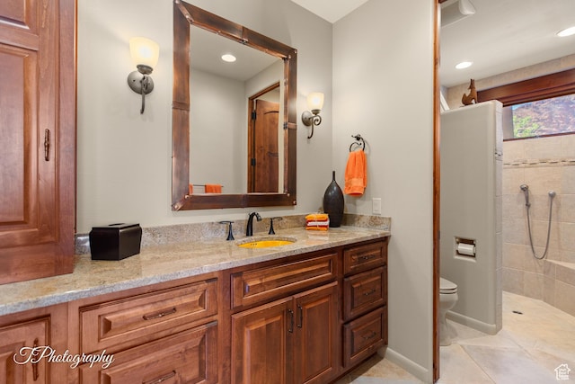1936 N Uwan Dr, Ivins, UT 84738 - full bathroom featuring toilet, tiled shower, vanity, tile patterned floors, and recessed lighting