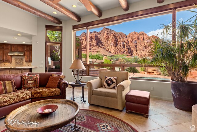 1936 N Uwan Dr, Ivins, UT 84738 - living area featuring a mountain view, light tile patterned flooring, beamed ceiling, recessed lighting, and baseboards