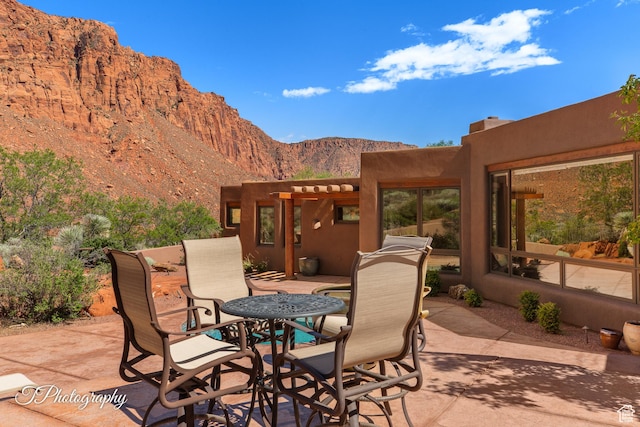 1936 N Uwan Dr, Ivins, UT 84738 - view of patio / terrace with a mountain view and outdoor dining area