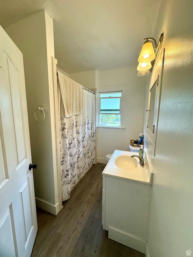 52 W 2000 N, Sunset, UT 84015 - bathroom featuring wood finished floors, vanity, toilet, baseboards, and curtained shower