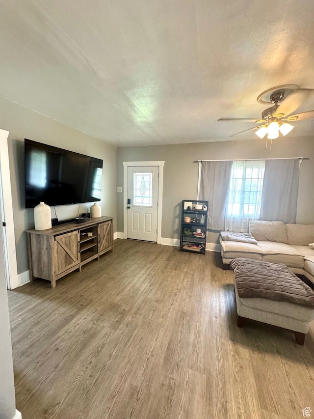 52 W 2000 N, Sunset, UT 84015 - living area featuring wood finished floors, baseboards, and a ceiling fan