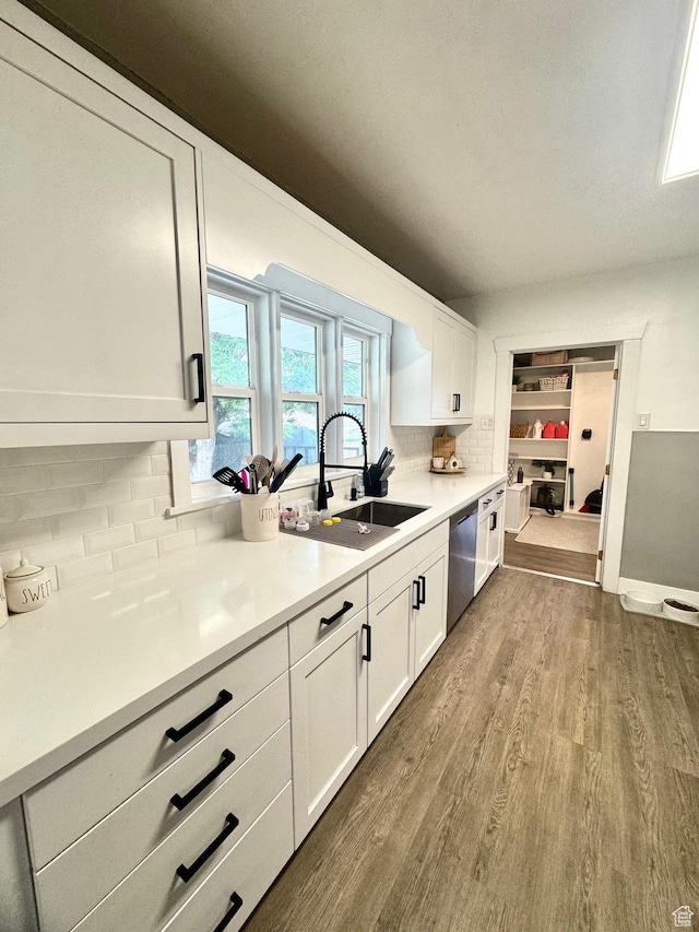 52 W 2000 N, Sunset, UT 84015 - kitchen featuring a sink, dark wood-style flooring, decorative backsplash, and white cabinetry