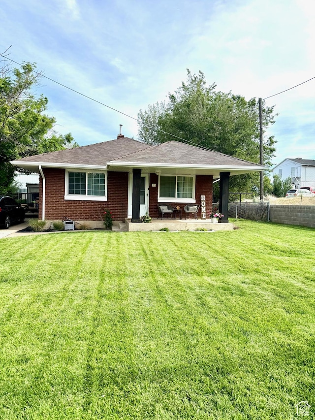 52 W 2000 N, Sunset, UT 84015 - view of front of house with brick siding and covered porch