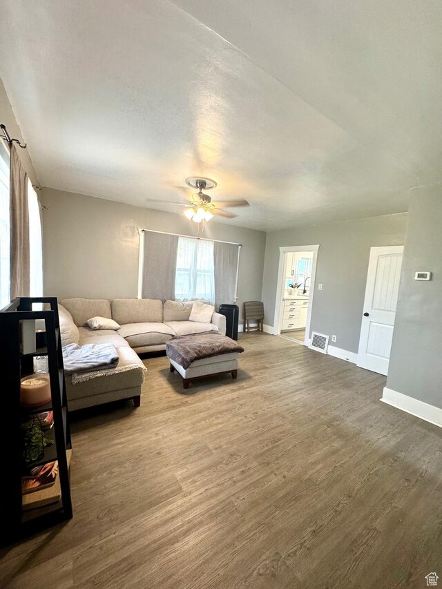 52 W 2000 N, Sunset, UT 84015 - living room featuring wood finished floors, baseboards, and a ceiling fan