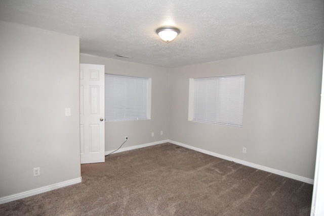 2236 E 1480 S, Spanish Fork, UT 84660 - empty room with dark carpet, baseboards, and a textured ceiling