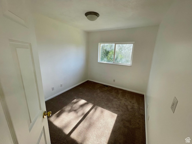 6939 S Florentine Way, West Jordan, UT 84084 - unfurnished room with dark colored carpet and baseboards