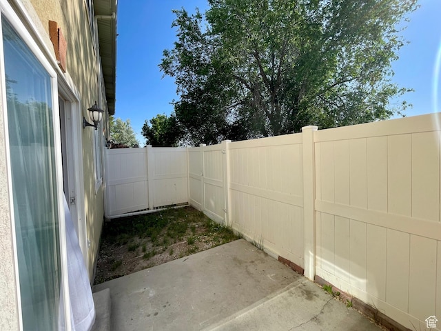 6939 S Florentine Way, West Jordan, UT 84084 - fenced backyard featuring a patio