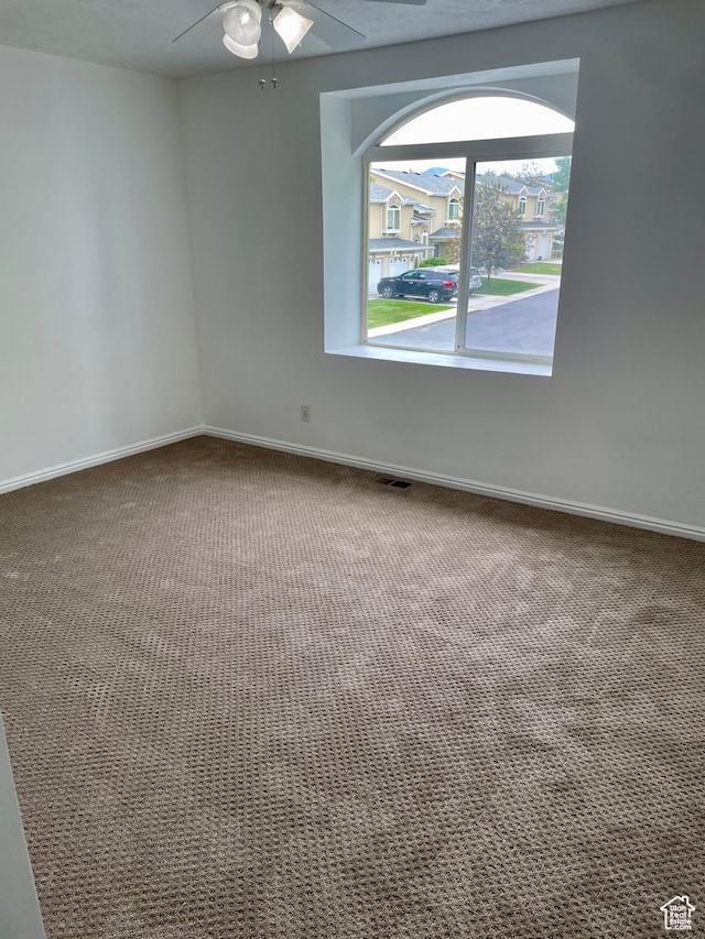 6939 S Florentine Way, West Jordan, UT 84084 - carpeted empty room with baseboards and ceiling fan