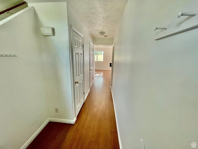 6939 S Florentine Way, West Jordan, UT 84084 - hallway with wood finished floors and a textured ceiling