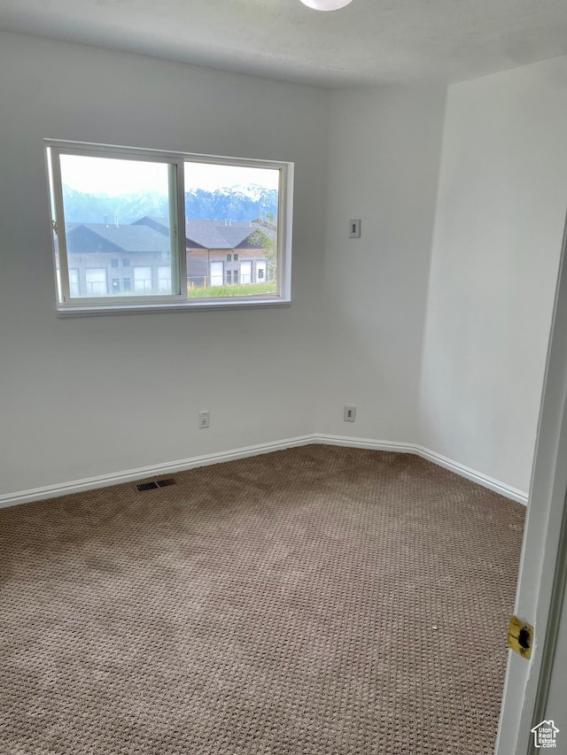 6939 S Florentine Way, West Jordan, UT 84084 - spare room featuring carpet and baseboards