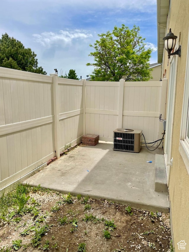 6939 S Florentine Way, West Jordan, UT 84084 - view of patio featuring cooling unit