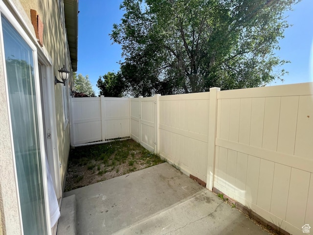 6939 S Florentine Way, West Jordan, UT 84084 - fenced backyard featuring a patio