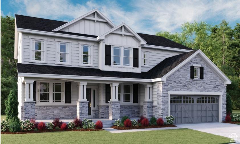 894 W Fallow Dr Unit 214, Saratoga Springs, UT 84045 - craftsman-style home featuring a porch, board and batten siding, stone siding, a front yard, and driveway