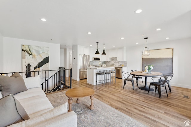984 Uri Ln Unit 3, Midway, UT 84049 - living area with recessed lighting, baseboards, and light wood-style flooring