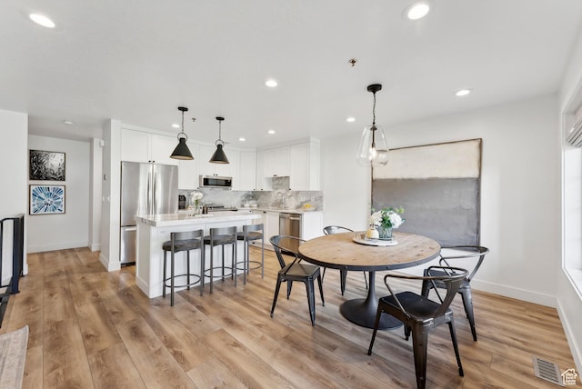 984 Uri Ln Unit 3, Midway, UT 84049 - dining area with recessed lighting, light wood-style floors, and baseboards