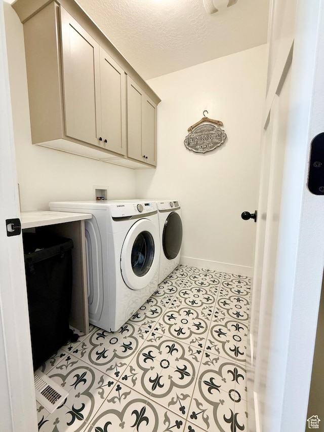 1384 E Abigail Ln, Eagle Mountain, UT 84005 - laundry area with cabinet space, washer and dryer, and a textured ceiling