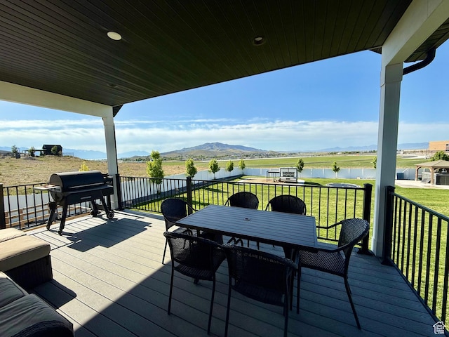 1384 E Abigail Ln, Eagle Mountain, UT 84005 - wooden terrace featuring a water and mountain view, grilling area, a lawn, and outdoor dining area