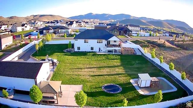 1384 E Abigail Ln, Eagle Mountain, UT 84005 - aerial view of residential area featuring a mountain backdrop